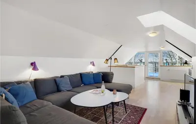 a living room with a couch and a table at Pet Friendly Home In Vils With Sauna in Vils