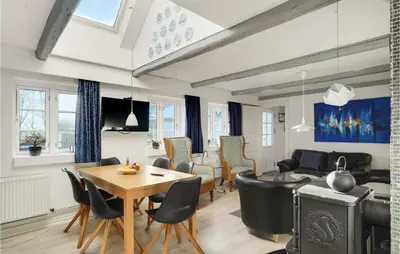 a living room with a table and chairs at Pet Friendly Home In Vils With Sauna in Vils