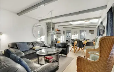 a living room with a couch and a table at Pet Friendly Home In Vils With Sauna in Vils