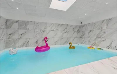 a bath tub with two rubber swans in it at Awesome Home In Nibe With Kitchen in Nibe