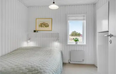 a white bedroom with a bed and a window at Lovely Home In Thisted With Wifi in Thisted