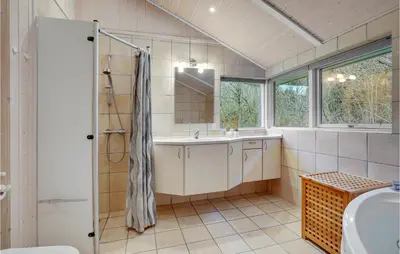 a bathroom with a sink and a shower at Lovely Home In Bedsted Thy With Sauna in Bedsted Thy