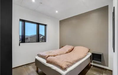 a bed in a white room with a window at Gorgeous Home In Thisted With Wifi in Thisted