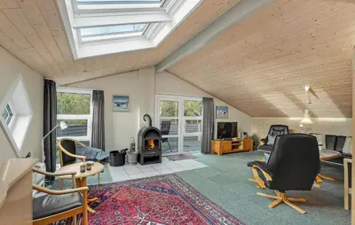 a living room with a vaulted ceiling and a fireplace at Amazing Home In Thisted With Sauna in Thisted