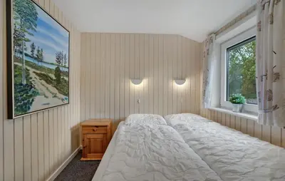 a bedroom with a white bed and a window at Amazing Home In Thisted With Sauna in Thisted