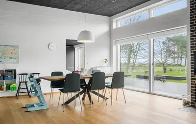 a dining room with a table and chairs at Awesome Home In Thyholm With Wifi in Thyholm