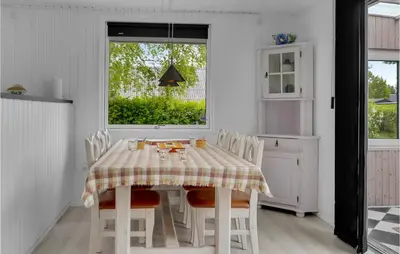 a dining room with a table and chairs and a window at Stunning Home In Vemb With Wifi in Vemb