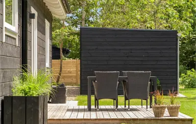 a table and chairs sitting on a patio at Gorgeous Home In Thyholm With Wifi in Thyholm