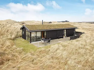 a small house in the middle of a field at 6 person holiday home in Pandrup-By Traum in Pandrup