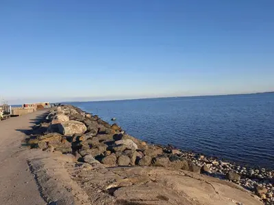 a group of rocks on the shore of a body of water at 6 person holiday home in Vesløs-By Traum in Øsløs