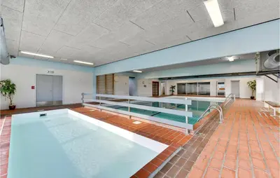 a large swimming pool in a large room at Gorgeous Apartment In Vestervig in Vestervig