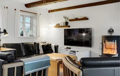 a living room with a couch and a table at Nice Home In Erslev With Wifi in Erslev