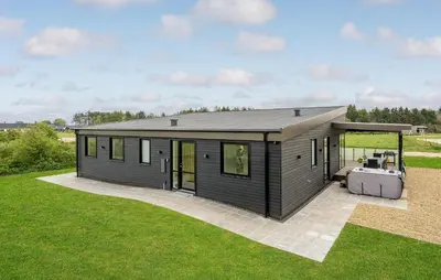 a modular house with a hot tub in a yard at Nice Home In Spøttrup With Sauna in Spottrup