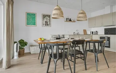 a kitchen and dining room with a table and chairs at Beautiful Home In Thisted With Wifi in Thisted