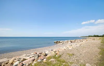 a group of rocks on the shore of the water at Lovely Home In Hurup Thy With Sauna in Sønder Ydby