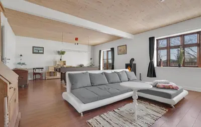 a living room with a couch and a table at Awesome Home In Bedsted Thy With Wifi in Bedsted Thy
