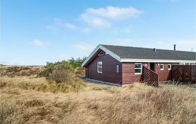 a small house in the middle of a field at 3 Bedroom Lovely Home In Frøstrup in Frøstrup