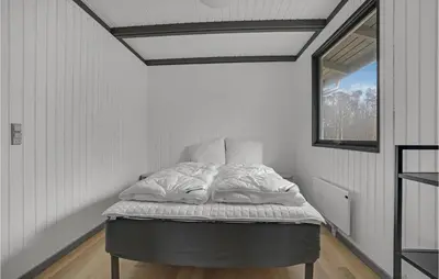 a bed in a white room with a window at Lovely Home In Hurup Thy With Wifi in Sønder Ydby