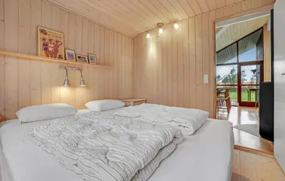 a bedroom with a large white bed in a room at Amazing Home In Spøttrup With Kitchen in Spottrup
