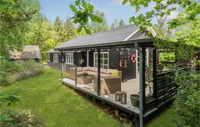 a black gazebo with a couch in a yard at 2 Bedroom Lovely Home In Højslev in Højslev