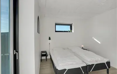 a hospital bed in a room with a window at Beautiful Home In Thisted With Sauna in Thisted