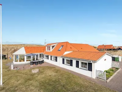 an image of a house with an orange roof at Holiday Home Pauli - 75m from the sea by Interhome in Harboør
