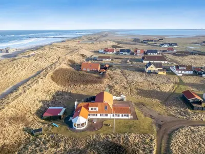 an aerial view of a village on the beach at Holiday Home Pauli - 75m from the sea by Interhome in Harboør