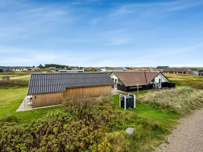 an aerial view of a house in a field at Holiday Home Olesia - 250m from the sea by Interhome in Harboør