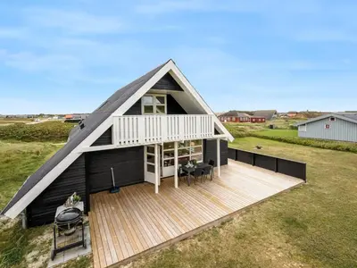 an overhead view of a black house with a deck at Holiday Home Amandus - 100m from the sea by Interhome in Harboør