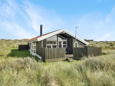a small house in the middle of a field at Holiday Home Suometar - 400m from the sea by Interhome in Torsted
