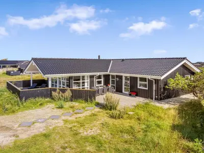 a house on the beach with a yard at Holiday Home Mauri - 350m from the sea by Interhome in Torsted