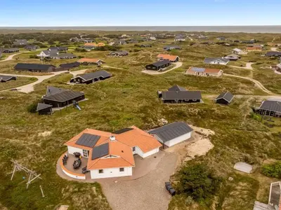 an aerial view of a home with solar panels on it at Holiday Home Palli - 600m from the sea by Interhome in Torsted