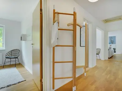 a room with a ladder and a room with a hallway at Holiday Home Flor - 900m from the sea by Interhome in Torsted