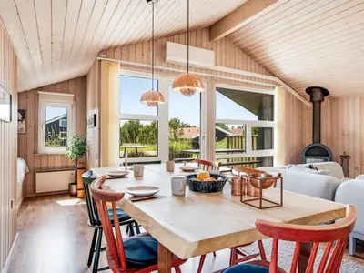 a dining room with a table and chairs at Holiday Home Suleika - 900m from the sea by Interhome in Torsted