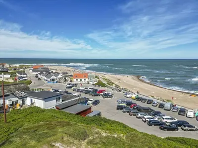 an aerial view of a parking lot next to the beach at Holiday Home Fris - 100m from the sea by Interhome in Torsted