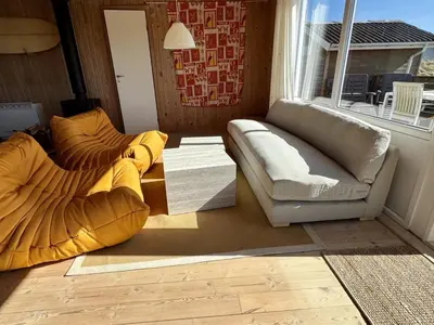 a living room with two couches and a window at Holiday Home Bera - 250m from the sea by Interhome in Torsted