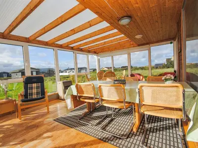 a dining room with a table and chairs at Holiday Home Gisela - 250m from the sea by Interhome in Torsted