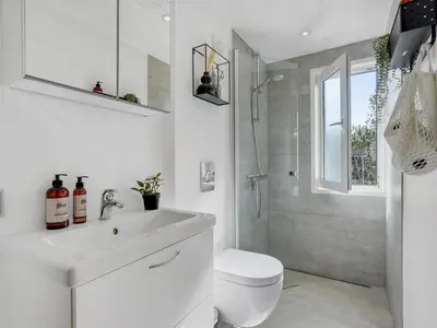 a bathroom with a sink and a toilet and a shower at Holiday Home Afke - 900m from the sea by Interhome in Torsted