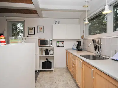 a kitchen with a sink and a counter top at Holiday Home Amber - 500m from the sea by Interhome in Torsted