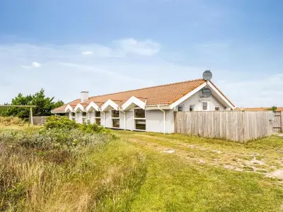 a house on a hill with a fence at Holiday Home Luzy - 600m from the sea by Interhome in Torsted