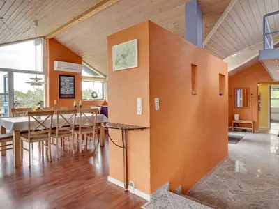 a dining room with a table and chairs at Holiday Home Bodulf - 600m from the sea by Interhome in Torsted