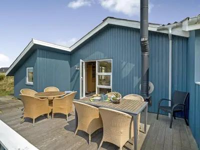 a patio with a table and chairs and a building at Holiday Home Fabiana - 350m from the sea by Interhome in Torsted