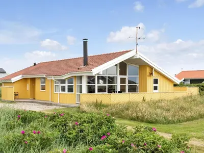 a yellow house with a red roof at Holiday Home Ritte - 200m from the sea by Interhome in Torsted