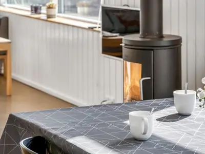a kitchen with a table with two cups on it at Holiday Home Ginne - 125m from the sea by Interhome in Torsted