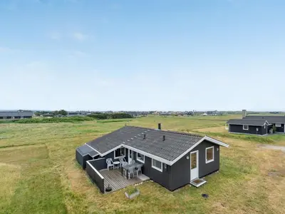 an overhead view of a black house in a field at Holiday Home Svea - 400m from the sea by Interhome in Torsted