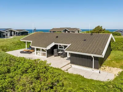 an overhead view of a house on a beach at Holiday Home Abel - 350m from the sea by Interhome in Løkken