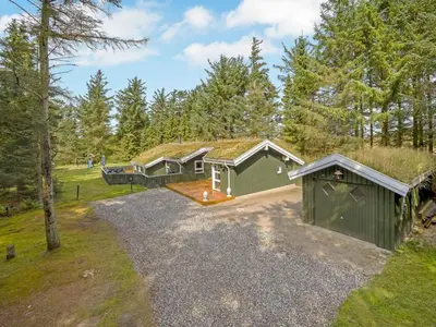 an overhead view of a house with a grass roof at Holiday Home Sunneva - 1km from the sea by Interhome in Løkken