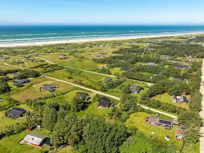 an aerial view of a house with the beach at Holiday Home Gullborg - 800m from the sea by Interhome in Løkken