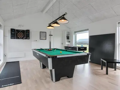 a billiard room with a pool table in it at Holiday Home Eveline - 1-5km from the sea by Interhome in Løkken