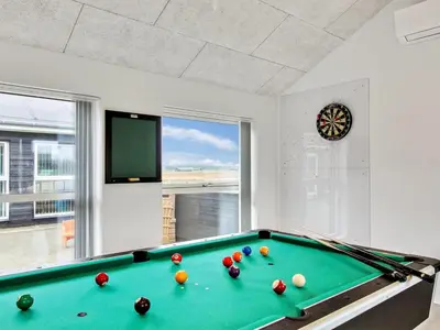 a billiard room with a green pool table at Holiday Home Edgar - 1-5km from the sea by Interhome in Løkken